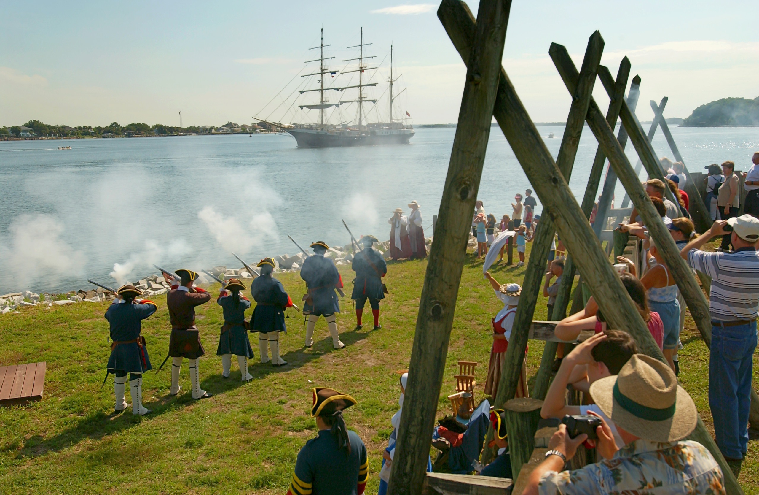 Photo courtesy WillDickey.com--06/10/04--Re-enactors fire a rifle salute to a tall ship on the St. Johns River as it passes by Fort Caroline during the Sail Jacksonville celebration June 10, 2004.  (www.willdickey.com)